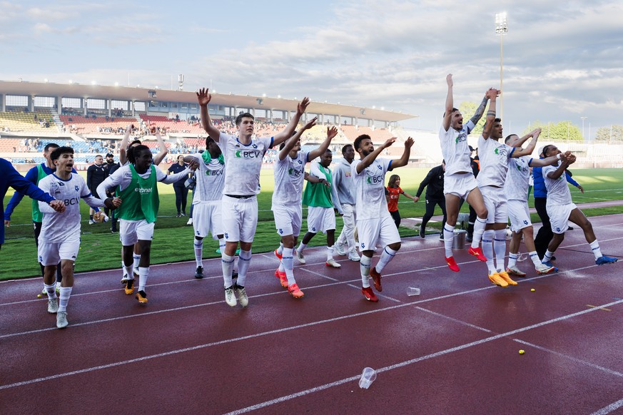 Lausanne-Sport players celebrate their victory after defeating the team Stade Lausanne-Ouchy, during the Super League Relegation Group soccer match of Swiss Championship between Stade Lausanne-Ouchy,  ...