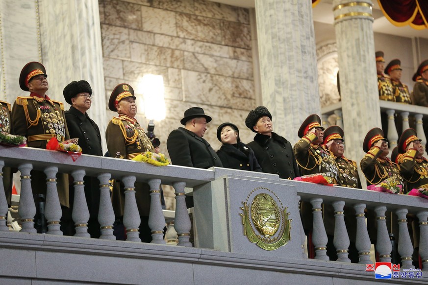 epa10455983 A photo released by the official North Korean Central News Agency (KCNA) shows North Korean Supreme leader Kim Jong-un (C-L) and his daughter Kim Jue-ae (C-R) viewing a military parade at ...