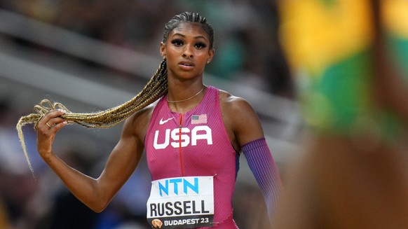 Masai Russell a sign