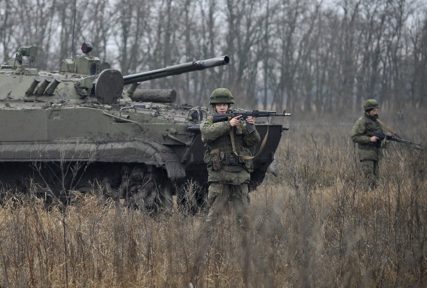 Russian troops take part in drills at the Kadamovskiy firing range in the Rostov region in southern Russia, Friday, Dec. 10, 2021. Russian troop concentration near Ukraine has raised Ukrainian and Wes ...