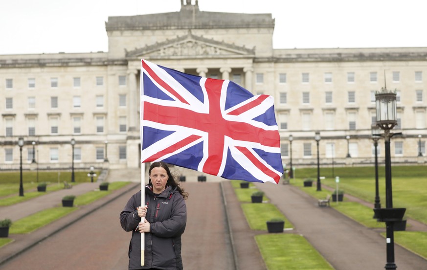 A Loyalist protester opposed to the Northern Ireland Protocol on Brexit makes a political point outside parliament buildings, Stormont, Belfast, Northern Ireland, Thursday, April 8, 2021 . (AP Photo/P ...