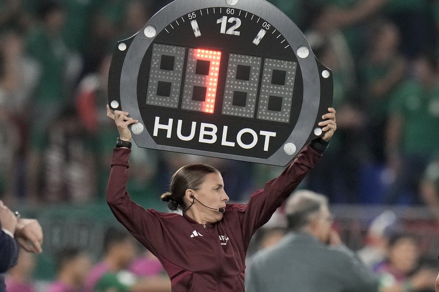 Referee assistant Stephanie Frappart of France shows 7 minutes overtime during the World Cup group C soccer match between Mexico and Poland, at the Stadium 974 in Doha, Qatar, Tuesday, Nov. 22, 2022.  ...