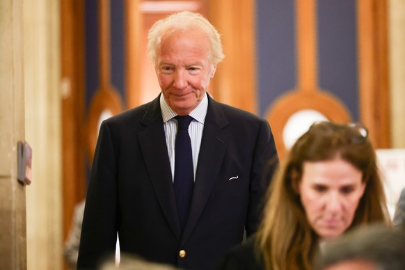 epa12872978 Former Interior Minister Brice Hortefeux leaves the courtroom during a pause on the first day of interrogation of former French president Nicolas Sarkozy during the appeal trial in the Lib ...