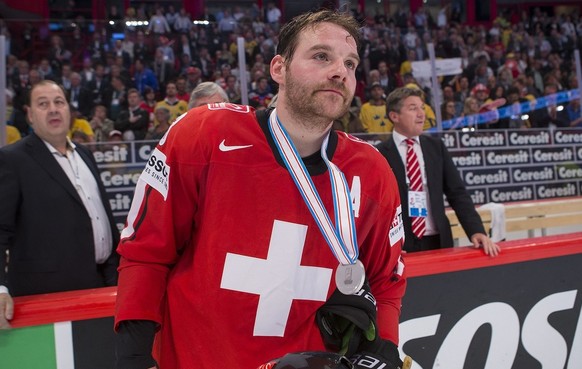 Switzerland&amp;#039;s Julien Vauclair look dejected after loosing against Sweden in the Gold Medal game between Switzerland and Sweden at the IIHF 2013 Ice Hockey World Championships at the Globe Are ...