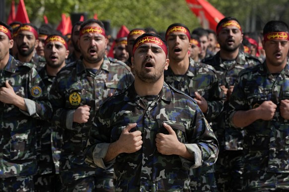 Volunteer troops of the Iranian army march during Army Day parade at a military base in northern Tehran, Iran, Wednesday, April 17, 2024. In the parade, President Raisi warned that the &quot;tiniest i ...