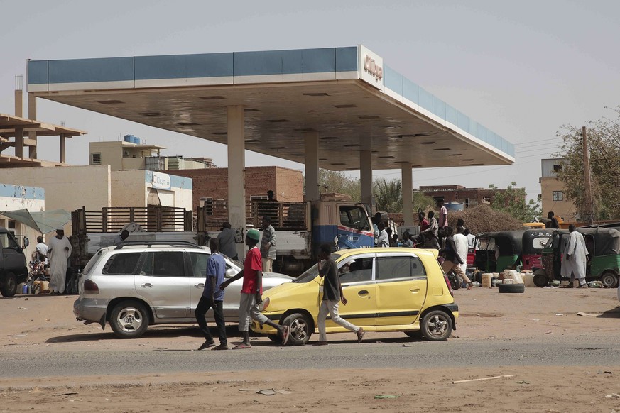 People line up at a gasoline station in Khartoum, Sudan, Saturday, April 29, 2023, as gunfire and heavy artillery fire continued despite the extension of a cease-fire between the country&#039;s two to ...