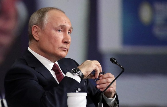 epa09247822 Russian President Vladimir Putin attends a plenary session of the St. Petersburg International Economic Forum (SPIEF) in St. Petersburg, Russia, 04 June 2021. The 24th St.Petersburg Intern ...