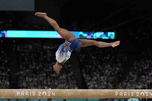 Simone Biles, of the United States, competes during the women&#039;s artistic gymnastics individual balance beam finals at Bercy Arena at the 2024 Summer Olympics, Monday, Aug. 5, 2024, in Paris, Fran ...