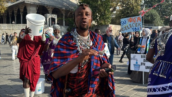 ISTANBUL, TURKIYE - NOVEMBER 03: Members of the Masai tribe from Tanzania wearing traditional costumes stage demonstration organized by Indernation Water Well Aid Association as they dance and sing to ...