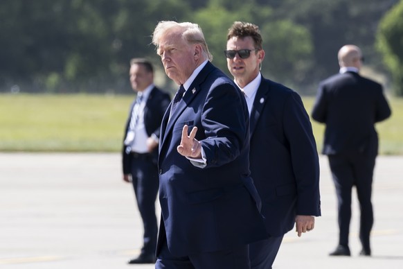 epaselect epa13039118 US President Donald J. Trump gestures after disembarking from Air Force One at Geneva Airport prior the G7 summit in Evian, in Geneva, Switzerland, 15 June 2026. The summit is sc ...