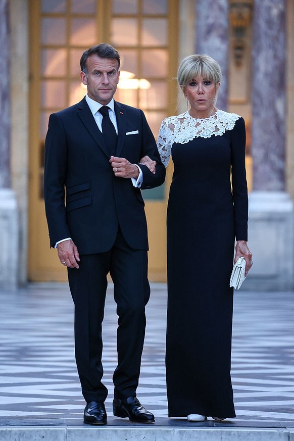 VERSAILLES, FRANCE - JUNE 17: President of France, Emmanuel Macron and Brigitte Macron stand as they wait for U.S President Donald Trump at Chateau de Versailles as French President Emmanuel Macron ho ...