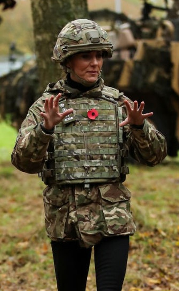 DEREHAM, ENGLAND - NOVEMBER 8: Catherine, Princess of Wales gestures as she visits The Queen's Dragoon Guards Regiment for the first time as their Colonel in Chief on November 8, 2023 in Dereham, ...