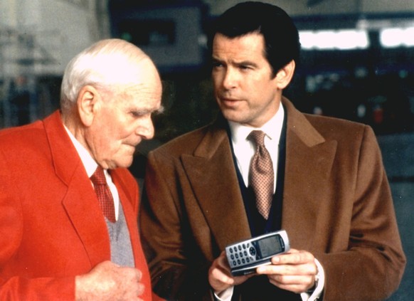 A scene from the Bond movie &quot;Tommorrow Never Dies&quot; which was released in 1997, with Desmond Llewelyn as Q and Pierce Brosnan as 007 James Bond, right. 85-year-old Llewelyn who was made famou ...