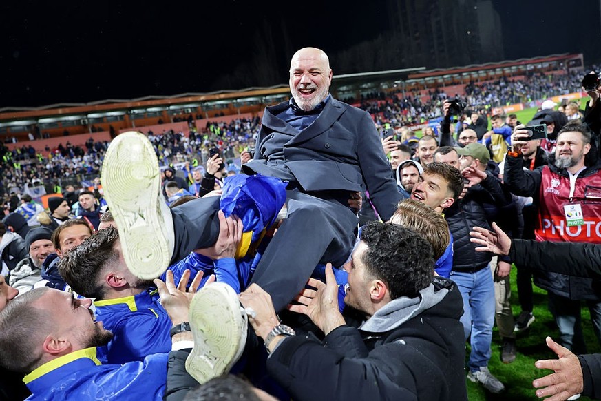 ZENICA, BOSNIA AND HERZEGOVINA - MARCH 31: Sergej Barbarez, Head Coach of Bosnia and Herzegovina, is lifted by his team as they celebrate victory and qualification for FIFA World Cup 2026 during the F ...