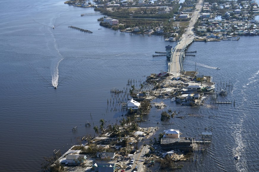 The bridge leading from Fort Myers to Pine Island, Fla., is seen heavily damaged in the aftermath of Hurricane Ian on Pine Island, Fla., Saturday, Oct. 1, 2022. Due to the damage, the island can only  ...