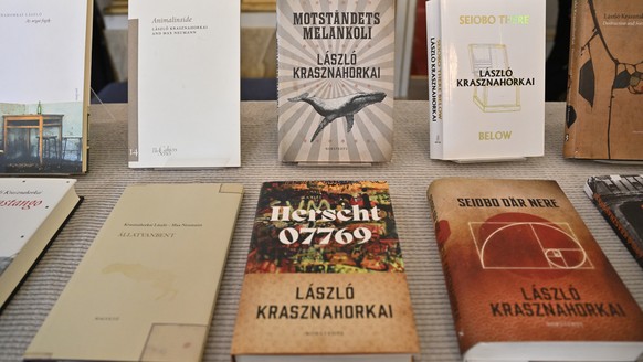 epa12441473 Books by Hungarian author Laszlo Krasznahorkai are displayed during the announcement of the 2025 Nobel Prize in Literature at Börshuset in Stockholm, Sweden, 09 October 2025. The 2025 Nobe ...