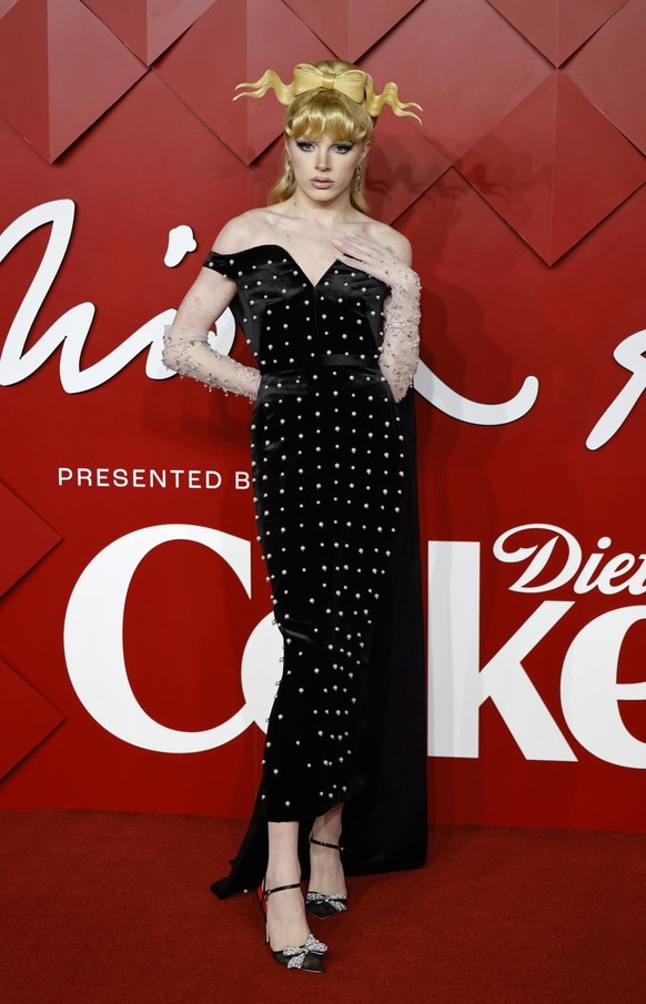 epa10350468 British drag artist Dakota Schiffer arrives for the Fashion Awards 2022 at the Royal Albert Hall in London, Britain, 05 December 2022. The gala event raises money to nurture future generat ...