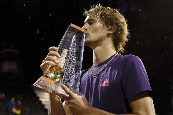 Alexander Zverev, of Germany, kisses the trophy after beating Nicolas Jarry, of Chile, during their final match, at the ATP 250 Geneva Open tournament in Geneva, Switzerland, Saturday, May 25, 2019. ( ...