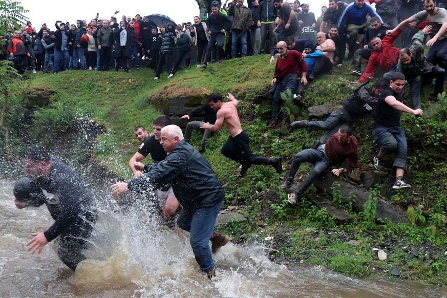 (FILES) Participants take part in the ancient game of Lelo Burti, (Field Ball), in the village of Shukhuti in the Guria region of Georgia on May 5, 2024, during the Orthodox Easter celebrations. The b ...