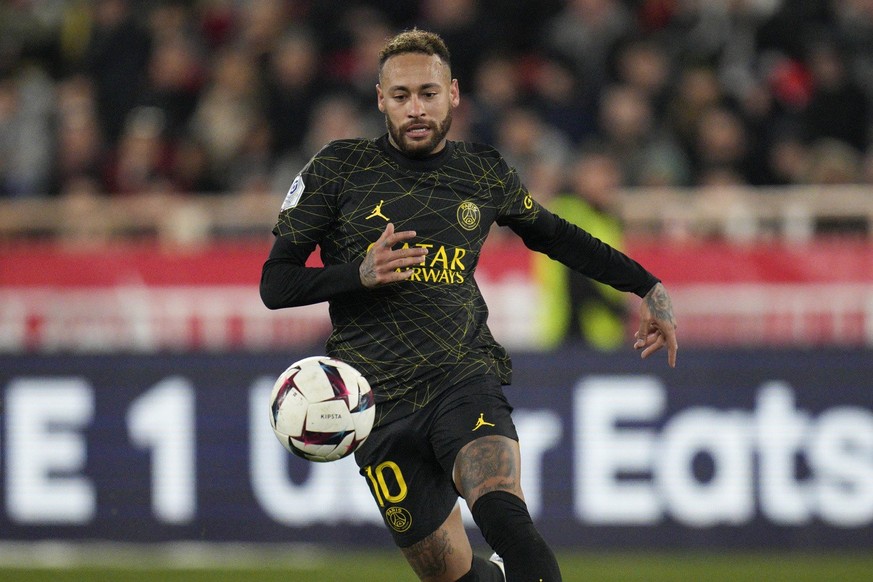 PSG&#039;s Neymar goes for the ball during a French League One soccer match between Monaco and Paris Saint-Germain at the Stade Louis II in Monaco, Saturday, Feb. 11, 2023. (AP Photo/Daniel Cole)