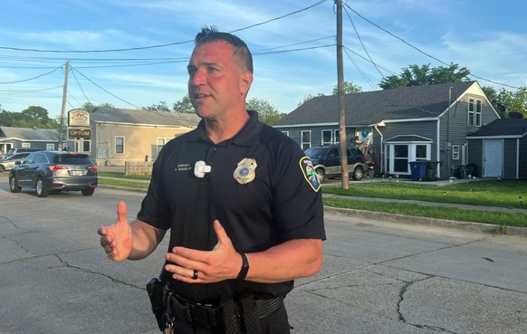 Shreveport Police Department Corporal Chris Bordelon talks to the press across the street from the house where a mass shooting took place in Shreveport, Louisiana, on April 19, 2026. Eight children we ...