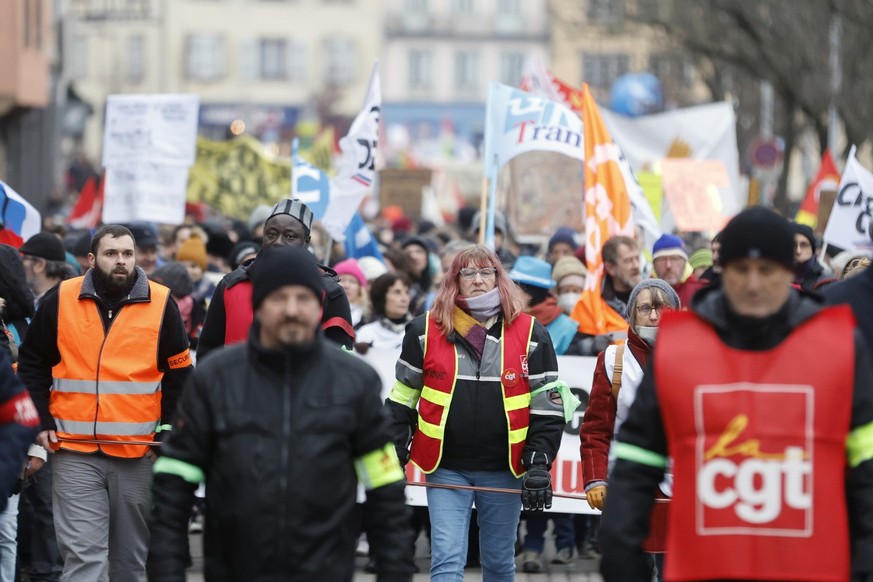 Demonstrators take part to a protest march against plans to push back France&#039;s retirement age, in Strasbourg, eastern France, Tuesday, Jan. 31, 2023. Labor unions aimed to mobilize more than 1 mi ...