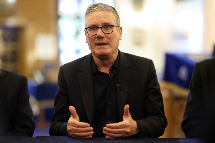 Britain's Prime Minister Keir Starmer speaks as he visits Kenton United Synagogue, which was recently the target of an attempted arson, in the Kenton district of London, Thursday, April 23, 2026. ...