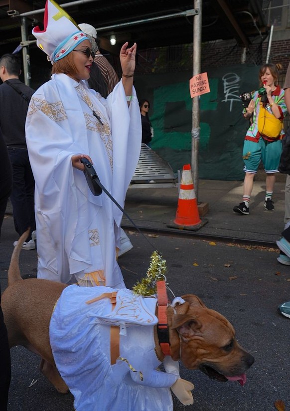 NEW YORK, UNITED STATES - OCTOBER 19: Dog owners in New York City are participating in the Tompkins Square Halloween Dog Parade, dressing their furry friends in colorful costumes on Sunday, October 19 ...