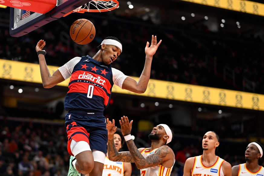 Washington Wizards guard Bilal Coulibaly (0) dunks during the first half of a Emirates NBA Cup basketball game against the Atlanta Hawks Tuesday, Nov. 25, 2025, in Washington. (AP Photo/John McDonnell ...