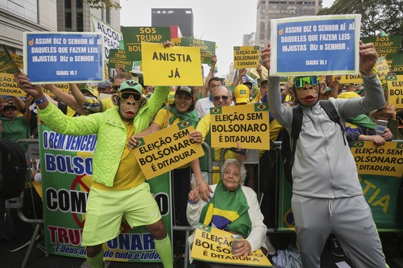 Supporters of former President Jair Bolsonaro protest his Supreme Court trial for allegedly leading a coup plot to keep him in office after his 2022 election defeat, in Sao Paulo, Sunday, Sept. 7, 202 ...