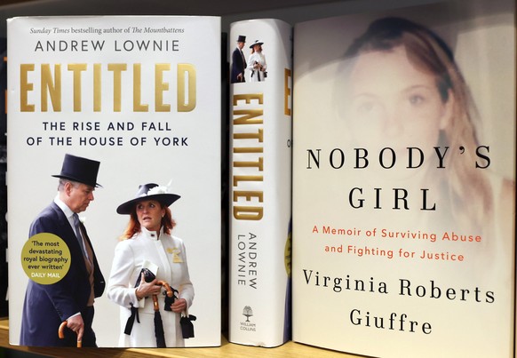epaselect epa12469495 Virginia Giuffre&#039;s posthumous memoir, titled &#039;Nobody&#039;s Girl&#039; (R), is on display at a bookshop after its publication in London, Britain, 21 October 2025. Giuff ...