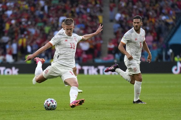 Spain&#039;s Dani Olmo attempts a shot at goal during the Euro 2020 soccer semifinal match between Italy and Spain at Wembley stadium in London, Tuesday, July 6, 2021. (AP Photo/Frank Augstein, Pool)