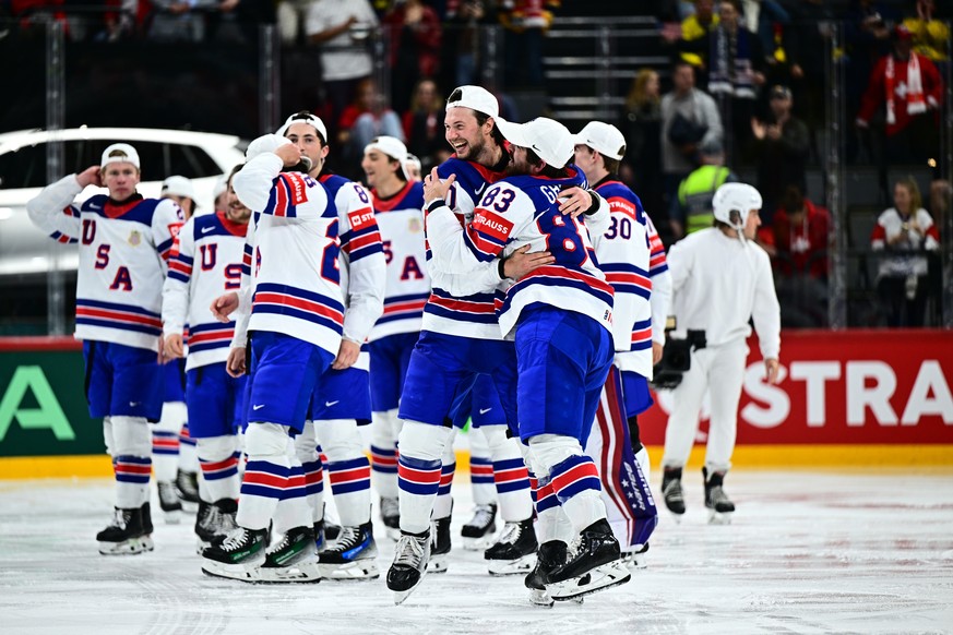 epa12135694 USA&#039;s players celebrate the 0-1 victory after Tage Thompson (#72) scored during overtime in the IIHF Ice Hockey World Championship final match between Switzerland and the USA at Avici ...
