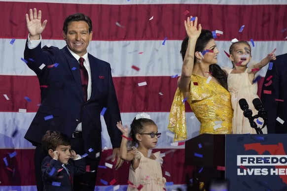 Incumbent Florida Republican Gov. Ron DeSantis, his wife Casey and their children on stage after speaking to supporters at an election night party after winning his race for reelection in Tampa, Fla., ...