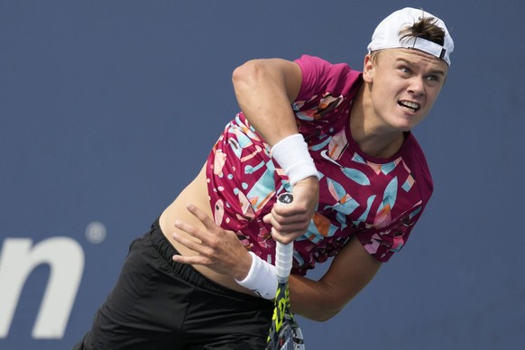 Holger Rune, of Denmark,serves to Roberto Carballes Baena, of Spain, during the first round of the U.S. Open tennis championships, Monday, Aug. 28, 2023, in New York. (AP Photo/John Minchillo)