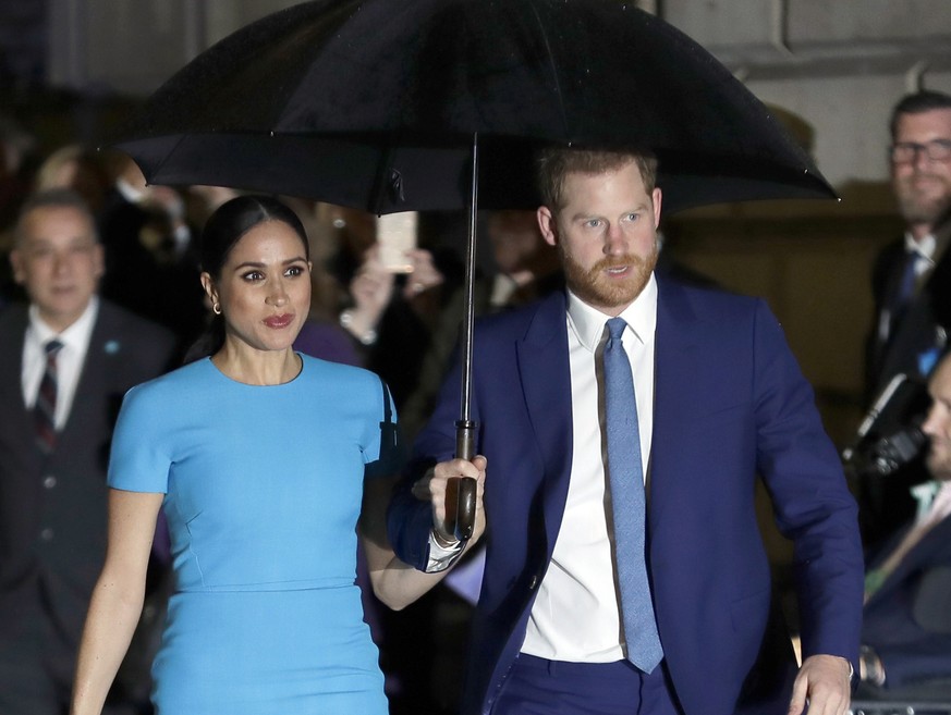 FILE Britain&#039;s Prince Harry and Meghan, the Duke and Duchess of Sussex arrive at the annual Endeavour Fund Awards in London, Thursday, March 5, 2020. Prince Harry can take the British government  ...