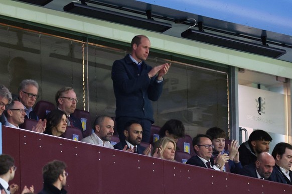 BIRMINGHAM, ENGLAND - APRIL 11: Prince William, Prince of Wales applauds as he watches from the stands during the UEFA Europa Conference League 2023/24 Quarter-final first leg match between Aston Vill ...