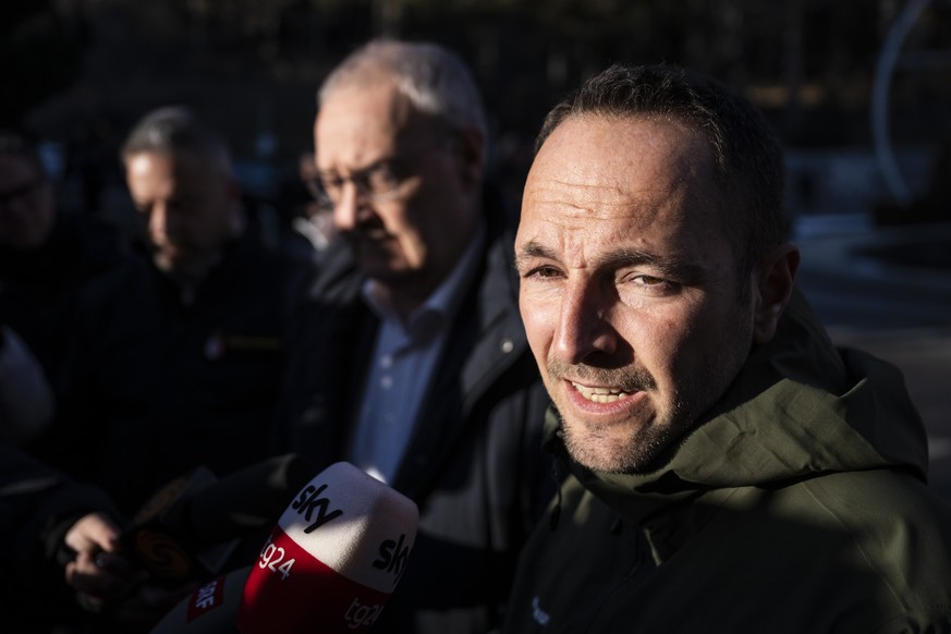 Mathias Reynard, State Councillor and president of the Council of State of the Canton of Valais, right, and Swiss Federal President Guy Parmelin, speak the the media after inspecting the area where a  ...