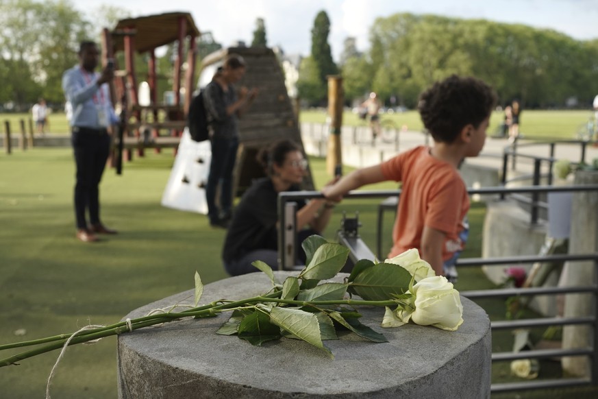 Roses lay at the playground after a knife attack Thursday, June 8, 2023 in Annecy, French Alps. A a man with a knife stabbed four young children at a lakeside park in the French Alps on Thursday, assa ...