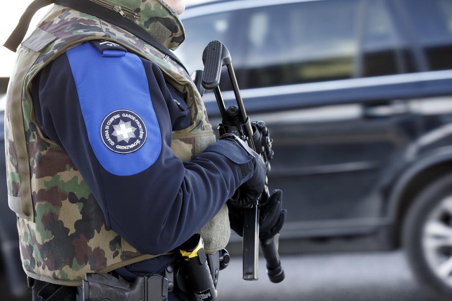 A Swiss border guards controls the area at the Bardonnex border, due to a high level of alert, in Bardonnex near Geneva, Switzerland, Friday, December 11, 2015. Police in Switzerland are hunting for f ...