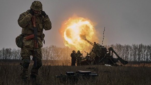 FILE - Ukrainian soldiers fire a Pion artillery system at Russian positions near Bakhmut, Donetsk region, Ukraine, Friday, Dec. 16, 2022. (AP Photo/LIBKOS, File)