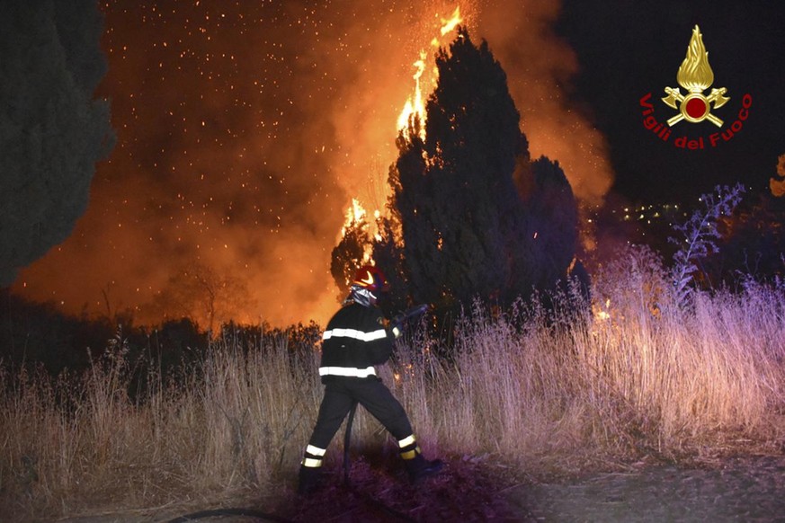 In this photo released by the Italian Firefighters, a view of a fire near Petralia Soprana, in the upper Madonie, near Palermo, Sicily, Italy, in the early hours of Wednesday, Aug. 11, 2021, as many w ...