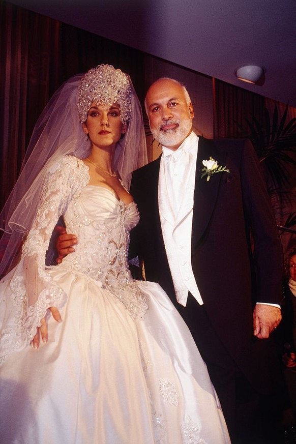 Record producer René Angelil and Canadian singer Céline Dion during their wedding ceremony. (Photo by Laurence Labat/Sygma via Getty Images)