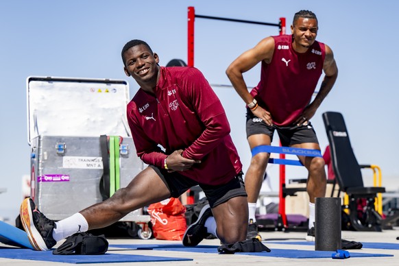 Switzerland&#039;s Breel Embolo and Switzerland&#039;s Manuel Akanji warm up during a training session of the Swiss national soccer team at the University of Utah soccer Field, in Salt Lake City, Utah ...