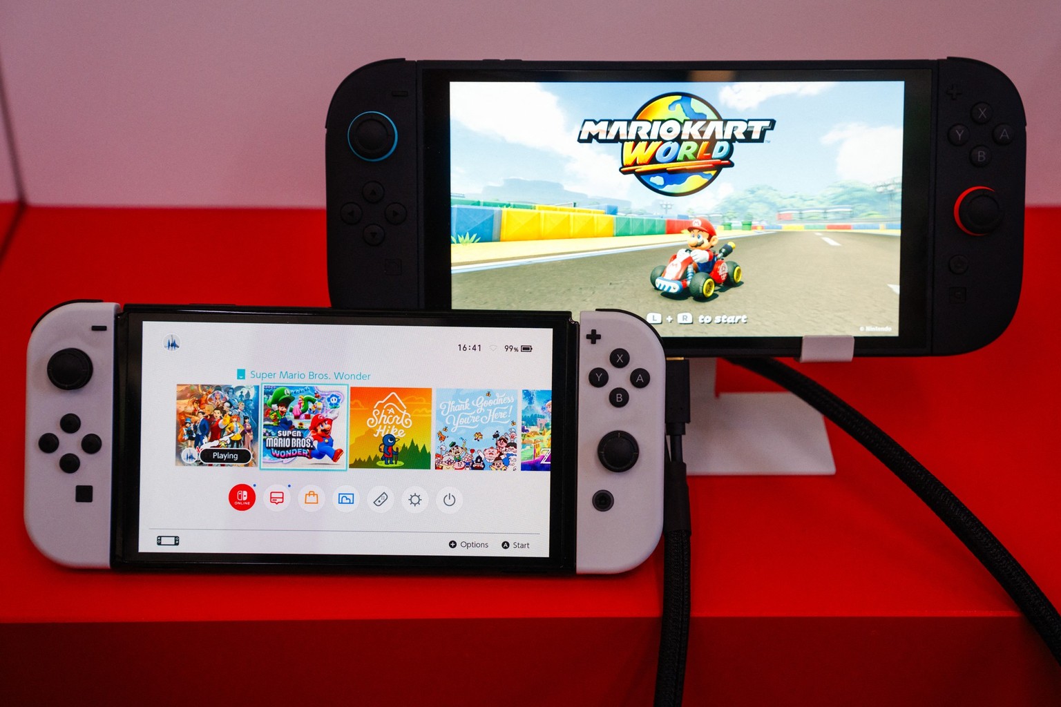 This photograph shows the new Nintendo Switch 2 (R) and the old one Nintendo Switch (L) systems for Japanese video-game company Nintendo during the worldwide presentation at the Grand Palais in Paris  ...