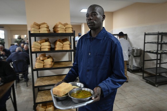 Kenyan national Evans Kibet, captured while fighting for Russian forces on the Ukrainian front, has his lunch at a detention center for Russian POWs in western Ukraine on November 26, 2025, amid the R ...