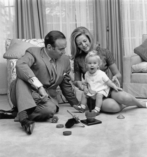 Australian media mogul Rupert Murdoch with his second wife Anna Maria Torv and their 14-month old daughter Elisabeth at their home in Sussex Gardens, London, 4th October 1969. Murdoch has recently bee ...