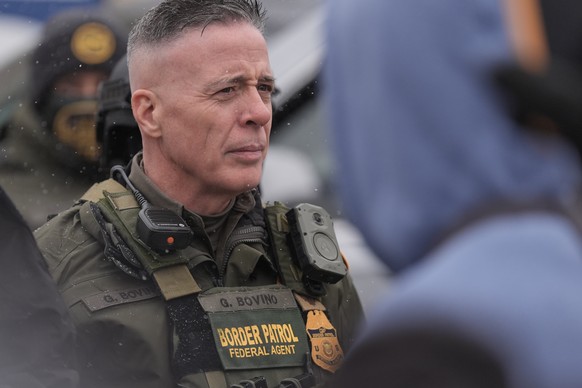 U.S. Border Patrol Cmdr. Gregory Bovino stands with Federal agents outside a convenience store on Wednesday, Jan. 21, 2026, in Minneapolis. (AP Photo/Angelina Katsanis)
Immigration Enforcement Minneso ...