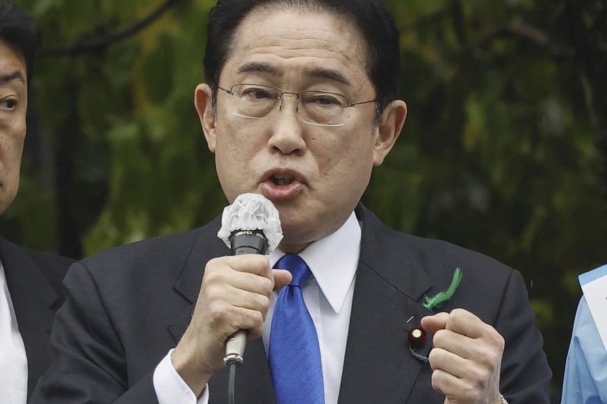 Japanese Prime Minister Fumio Kishida delivers a speech to support his ruling party?s candidate in a local election, near a train station in Wakayama, western Japan Saturday, April 15, 2023. Kishida w ...