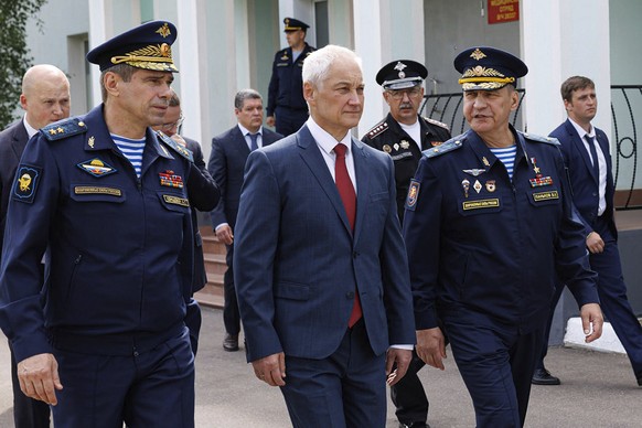 In this photo taken from video released by the Russian Defense Ministry on Tuesday, July 30, 2024, Russian Defense Minister Andrei Belousov, center, visits the 45th Special Forces Brigade of the Russi ...